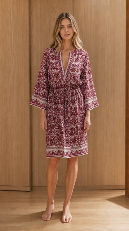 Front view of woman wearing burgundy printed midi dress