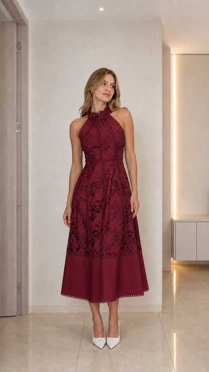 Model wearing burgundy halter neck floral lace midi dress