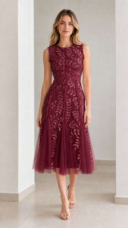 Front view of model wearing burgundy embroidered leaf applique midi dress