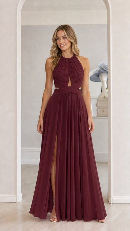 Model wearing burgundy chiffon halter maxi dress with front slit