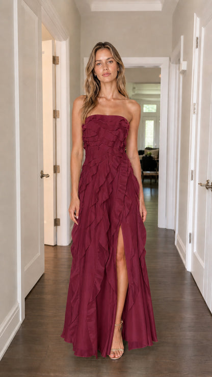 Model wearing burgundy strapless tiered ruffle maxi dress
