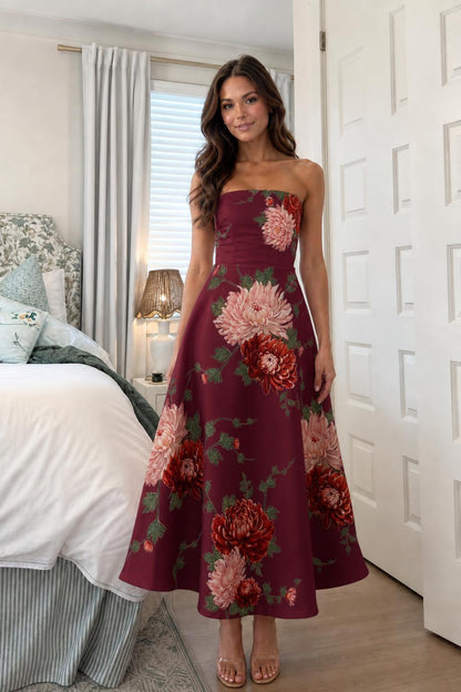 Woman wearing burgundy floral strapless midi dress