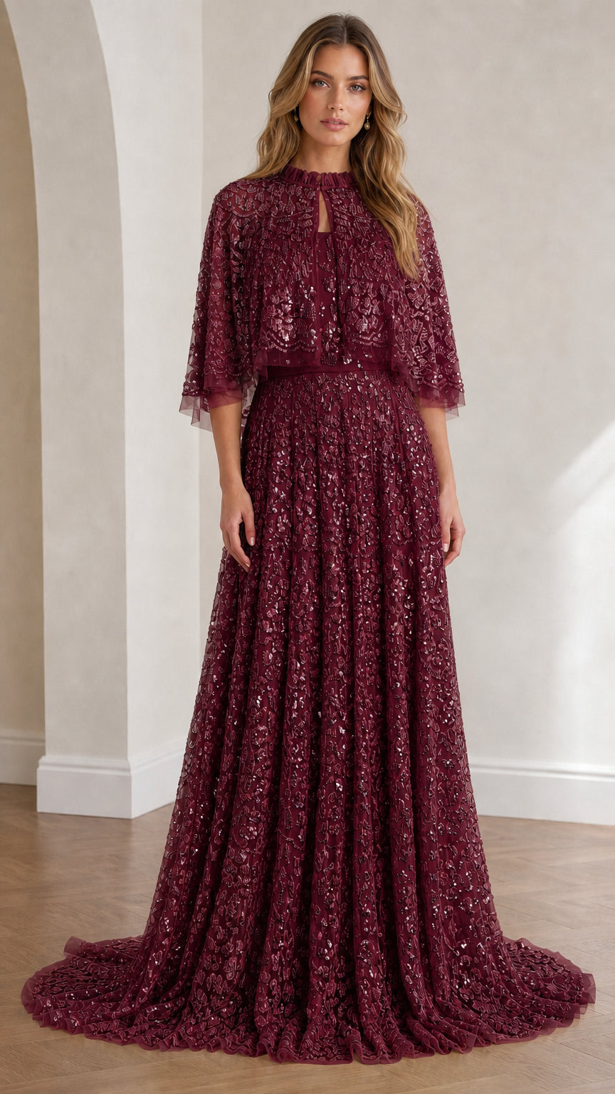 Full view of burgundy sequin lace capelet evening gown