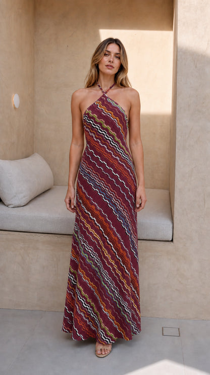 Model wearing burgundy-based chevron knit halter maxi dress
