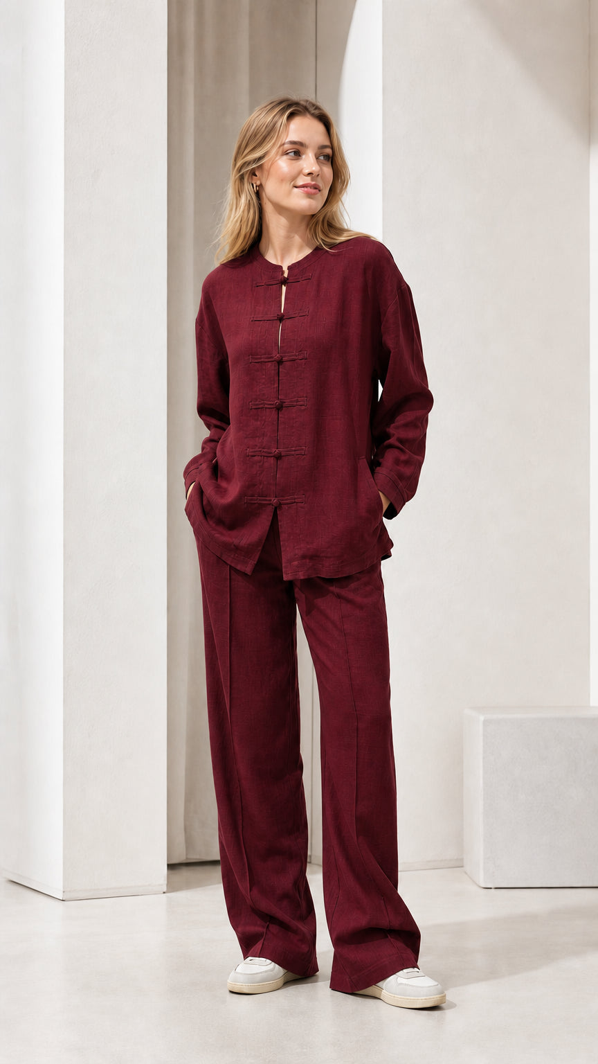 Model wearing burgundy linen-blend long sleeve top and wide leg pants set