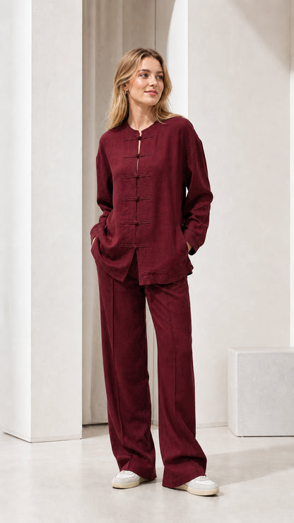 Model wearing burgundy linen-blend long sleeve top and wide leg pants set