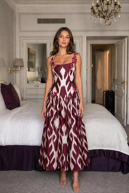 Model wearing burgundy ikat print midi dress