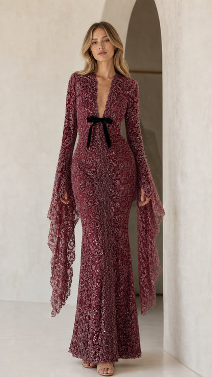 Model wearing burgundy sequin lace maxi dress