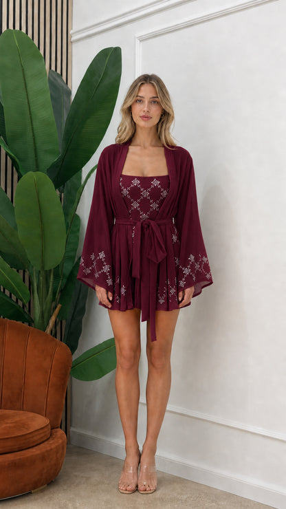 Front view of model wearing burgundy embellished three-piece kimono set