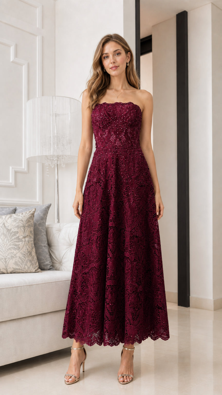 Front view of model wearing burgundy strapless lace midi dress