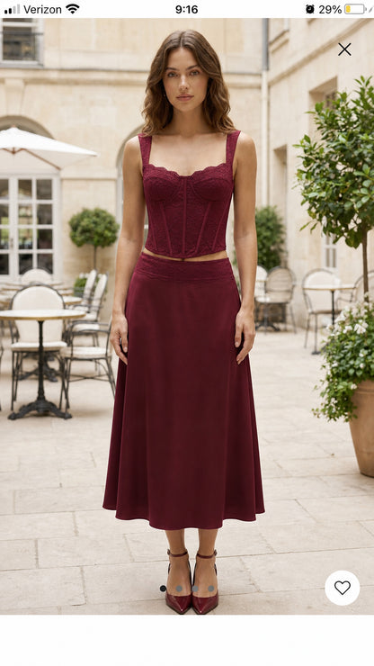 Front view of model wearing burgundy matching set