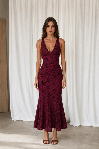 Front view of model in burgundy floral lace dress