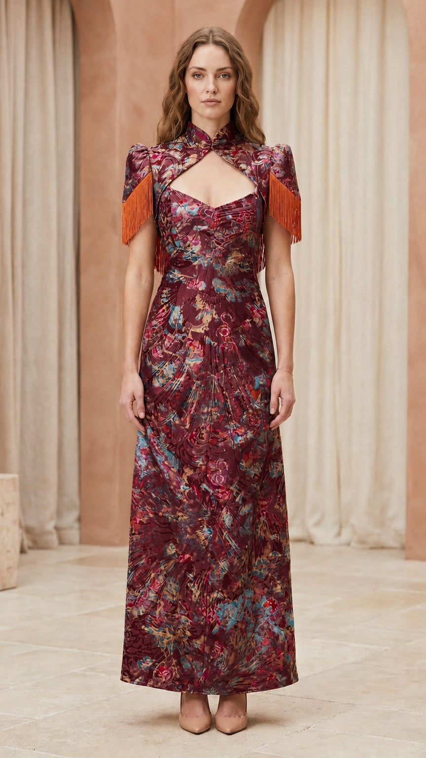 Front view of model wearing burgundy floral brocade maxi dress