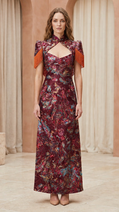 Front view of model wearing burgundy floral brocade maxi dress