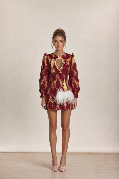 Model wearing burgundy baroque print mini dress