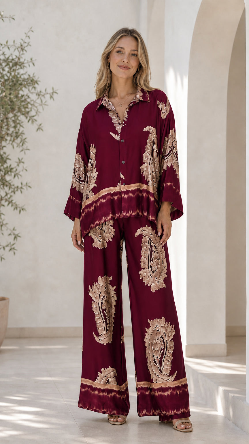 Front view of model in burgundy satin paisley print lounge set