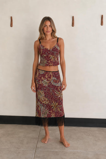 Front view of woman wearing Burgundy Multi paisley crop top and fringe skirt set