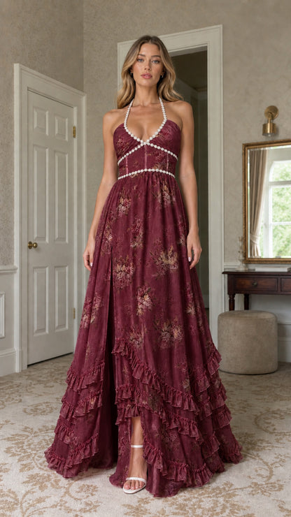Model wearing burgundy floral print pearl-trimmed halter maxi dress
