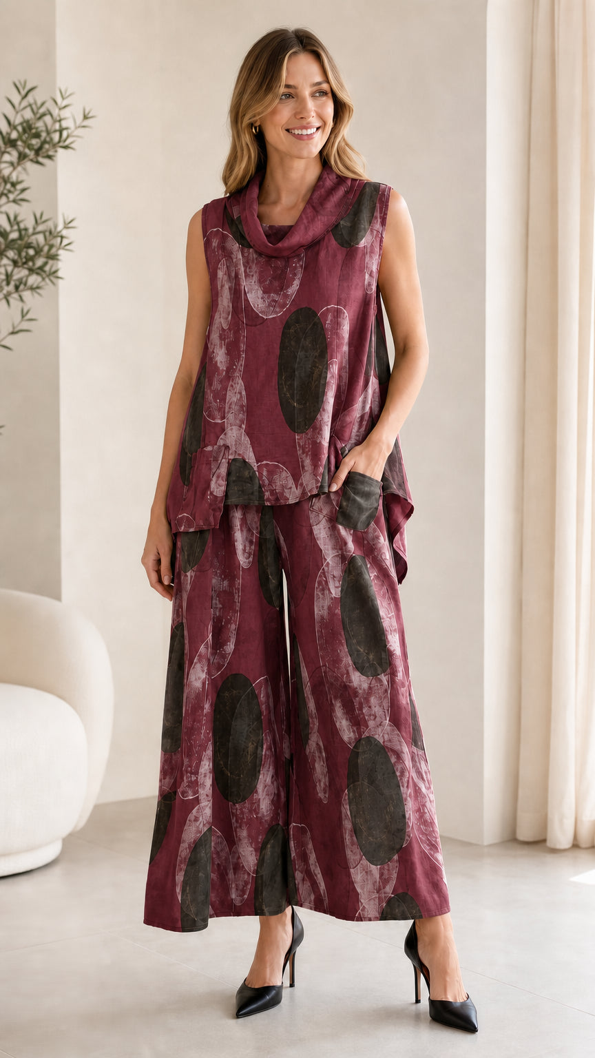 Front view of burgundy abstract print two-piece set on model