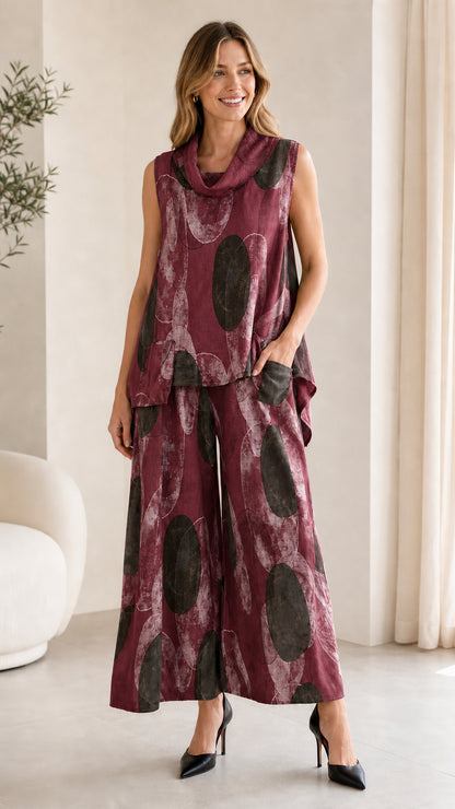 Front view of burgundy abstract print two-piece set on model