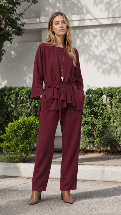 Woman wearing burgundy two-piece tunic and pants set
