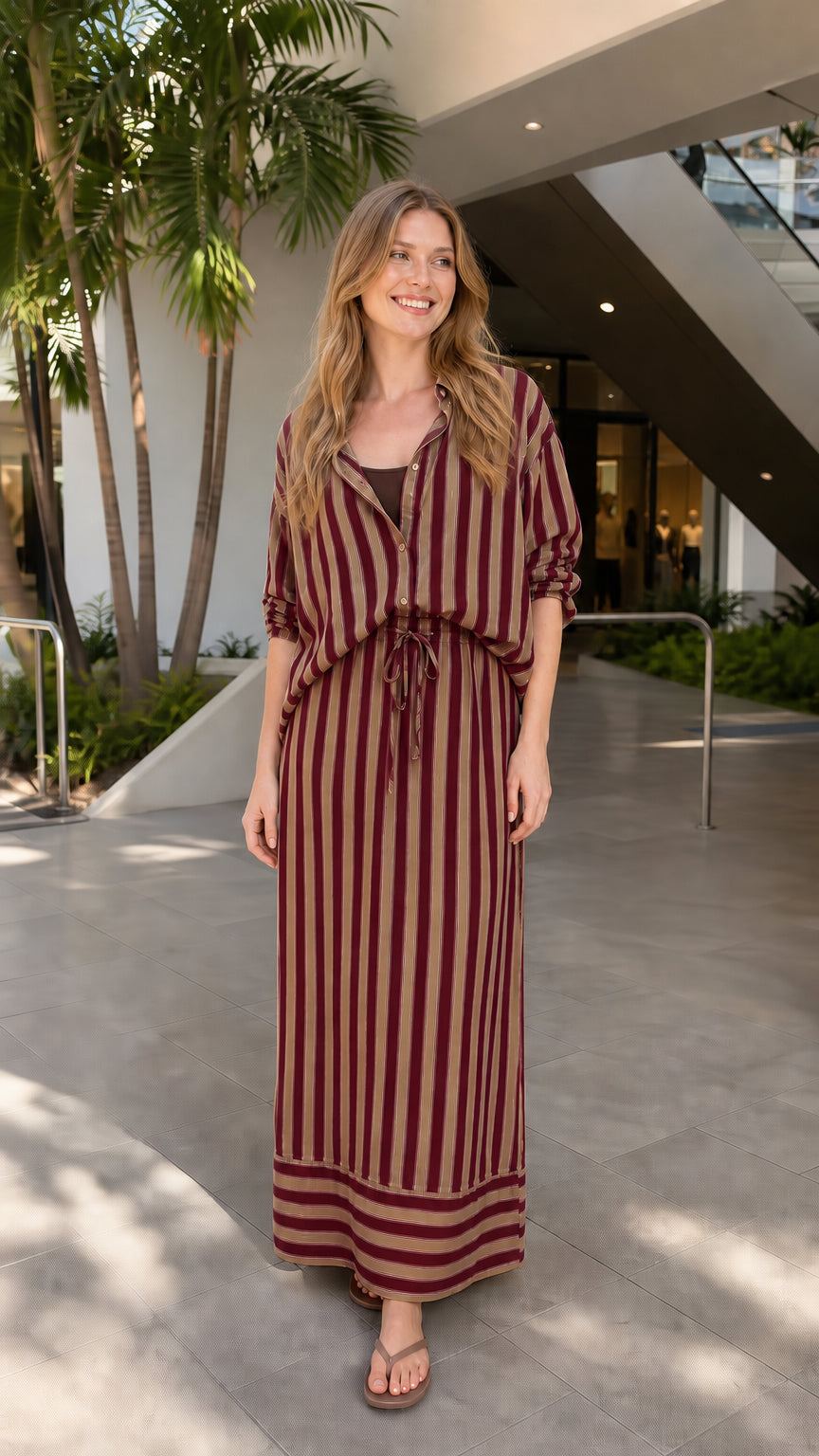 Model wearing burgundy striped two-piece set