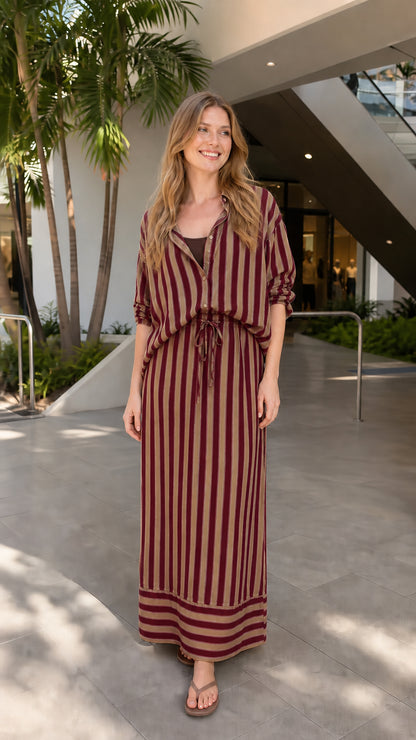 Model wearing burgundy striped two-piece set