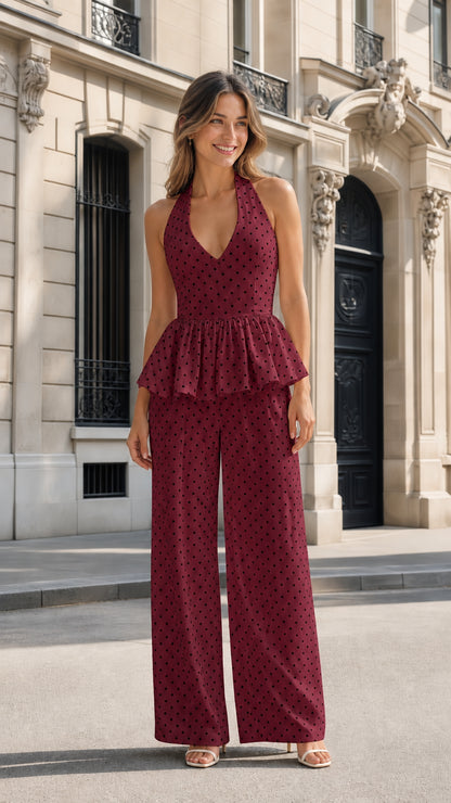 Front view of burgundy polka dot halter peplum jumpsuit