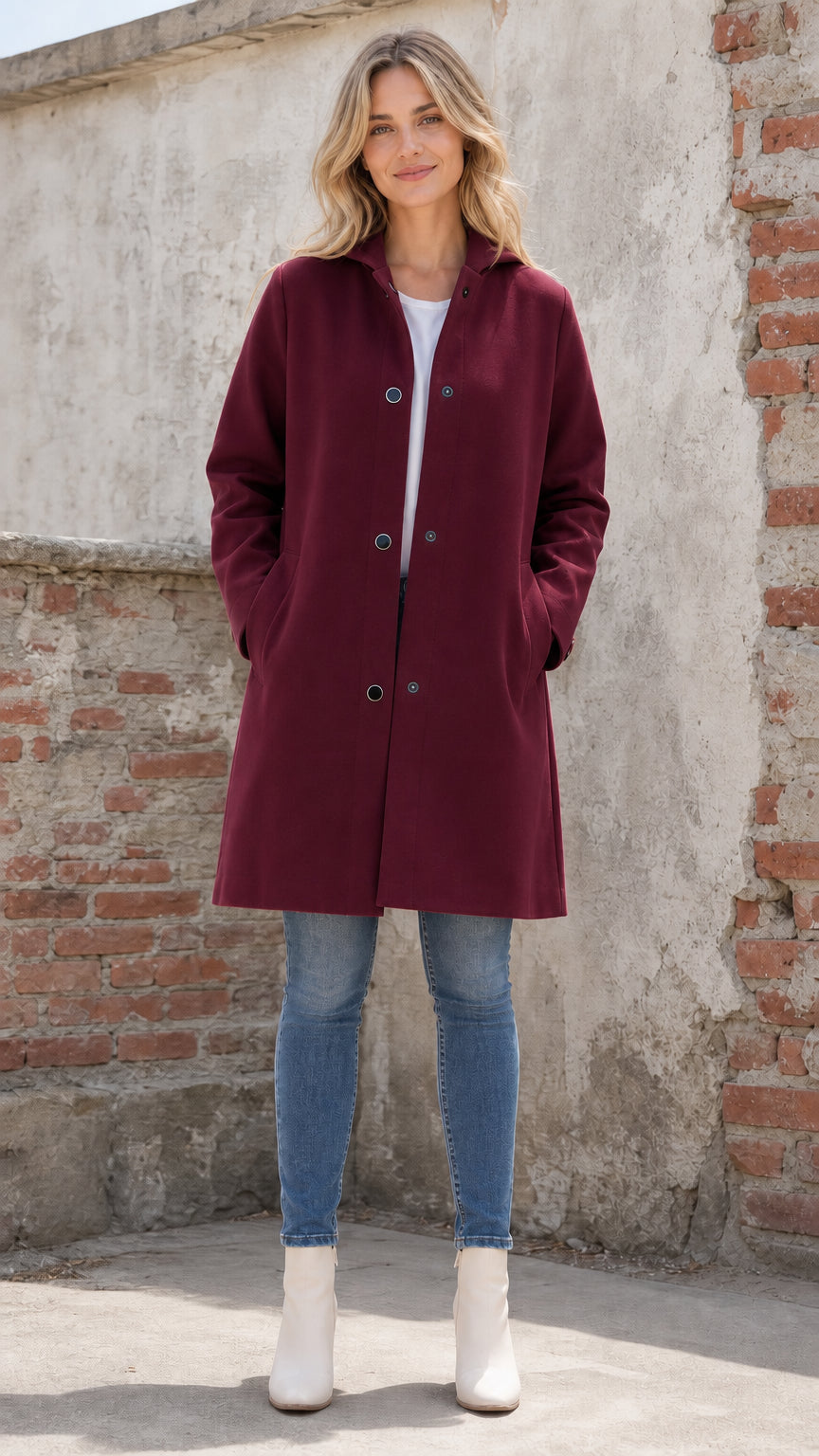 Front full view of woman wearing burgundy hooded coat