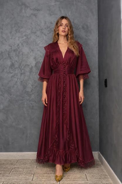 Model wearing burgundy vintage lace maxi dress
