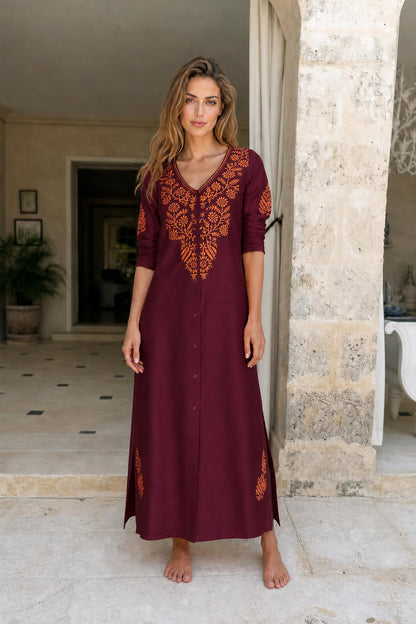 Model wearing burgundy embroidered maxi dress