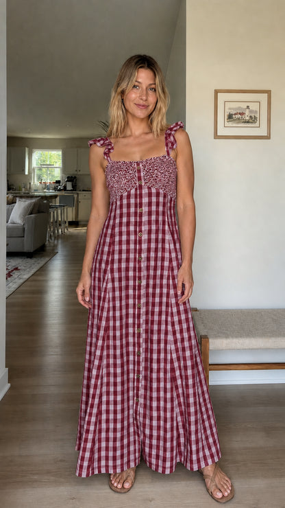 Woman wearing burgundy gingham maxi dress