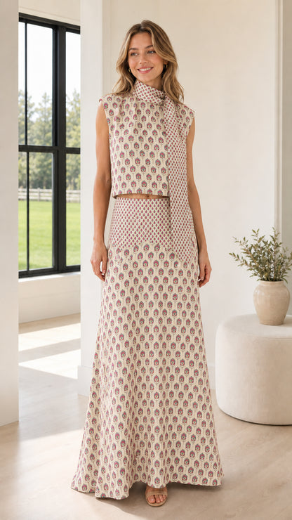 Front view of model wearing beige patterned two-piece set