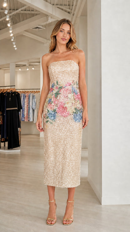 Model wearing champagne floral sequin strapless midi dress