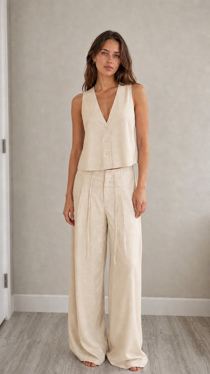 Full-length view of model in beige two-piece vest and pants set