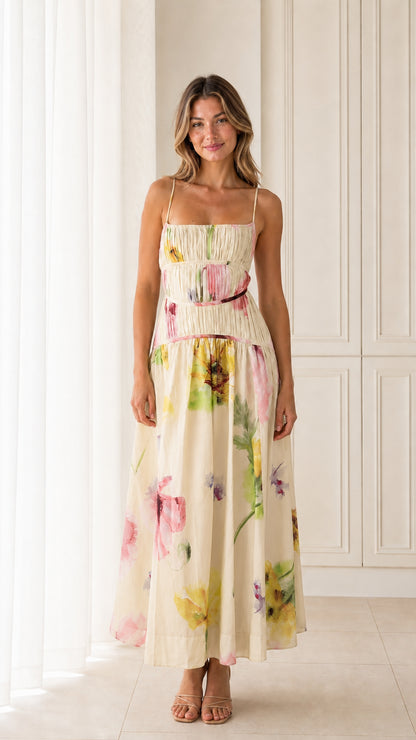 Front view of model wearing Cream floral smocked maxi dress