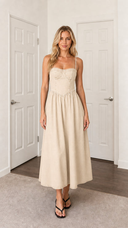 Front view of woman wearing beige denim midi dress