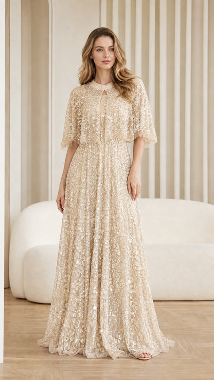 Front view of champagne sequin maxi dress