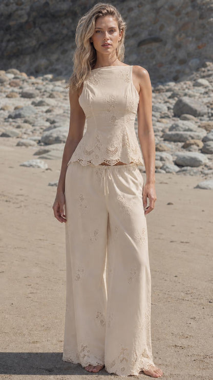 Woman wearing beige embroidered two-piece resort outfit