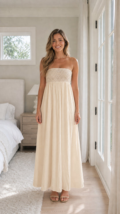 Full length view of woman wearing beige strapless maxi dress