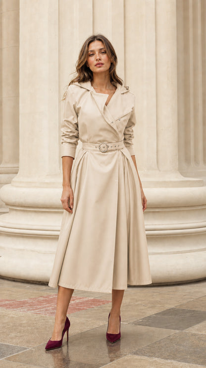 Front view of woman wearing beige hooded trench dress